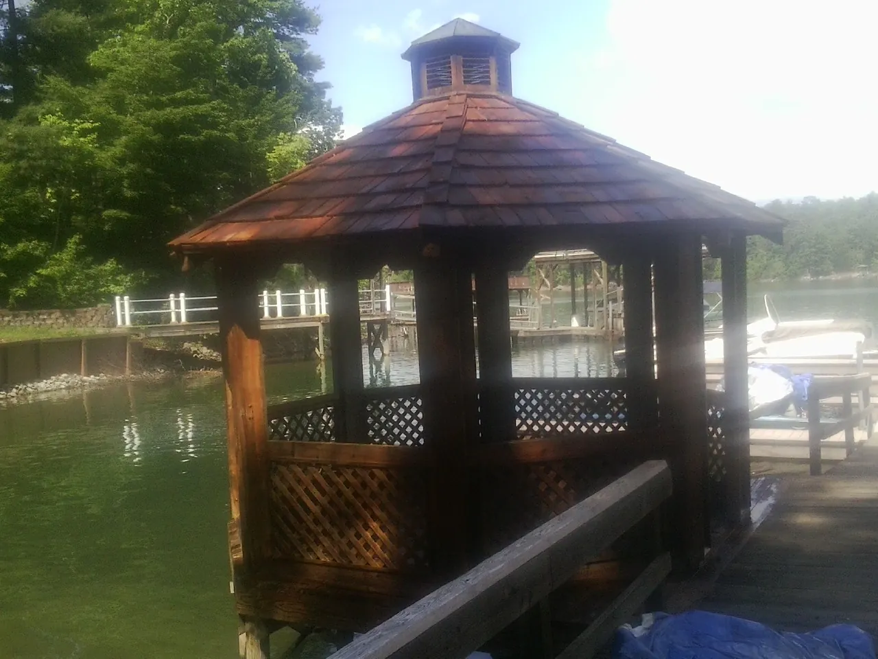 Cedar shake gazebo roof rebuilt on a lake dock in Maryville